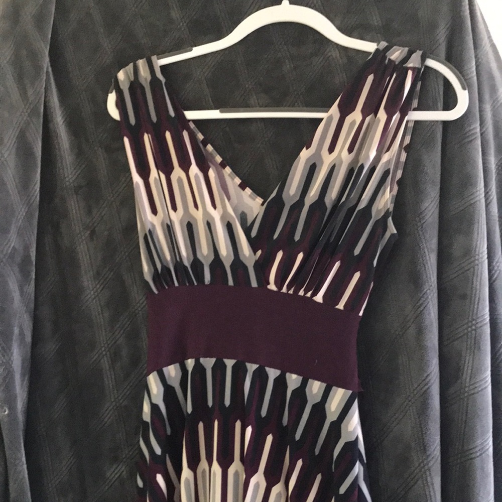 Sleeveless asymmetrical tie-back dress